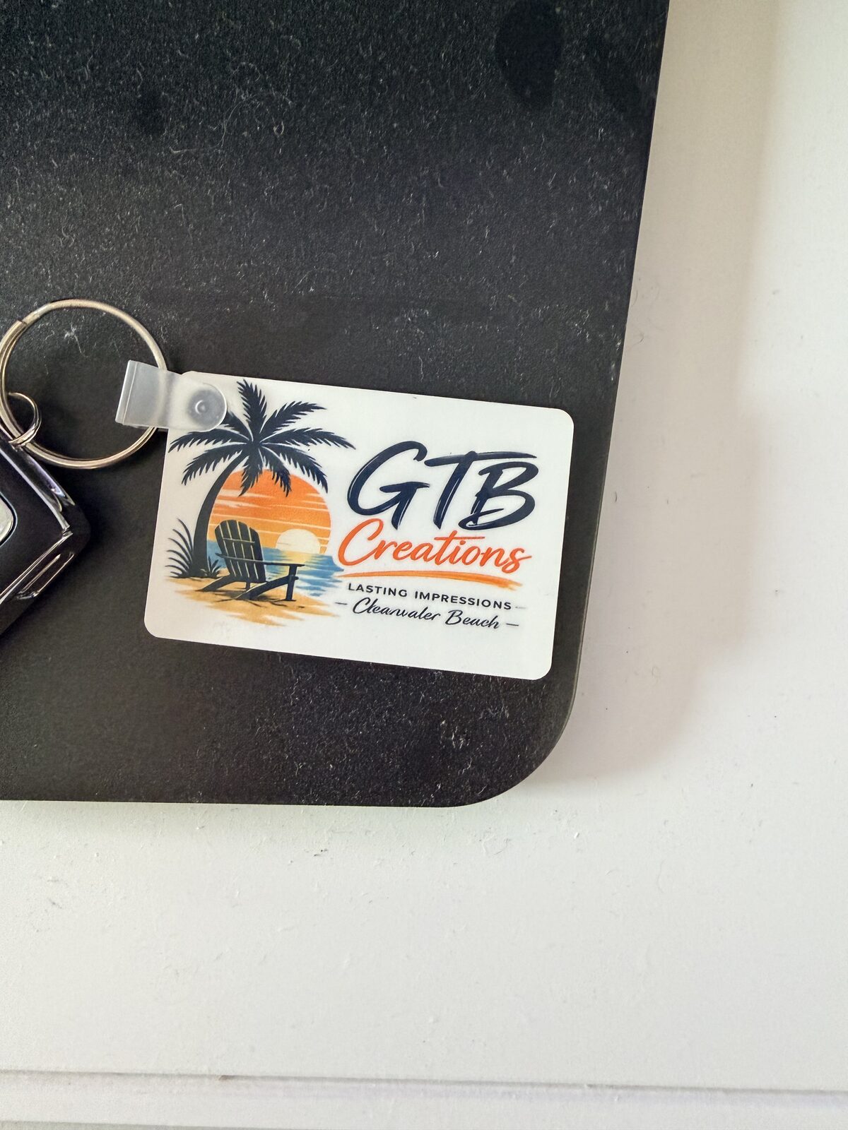 Custom laser-engraved keychain with GTB Creations logo